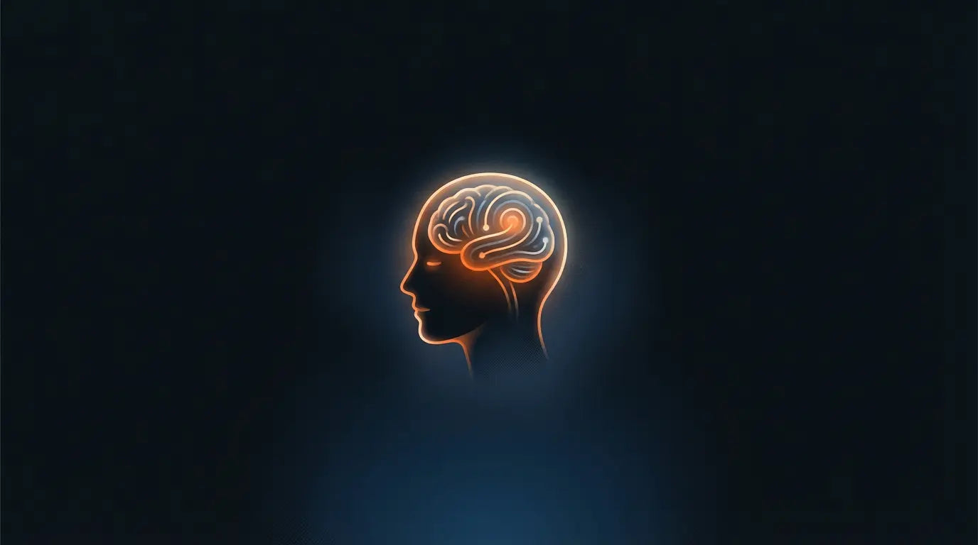 Glowing silhouette of a human head with an illuminated brain against a dark background.